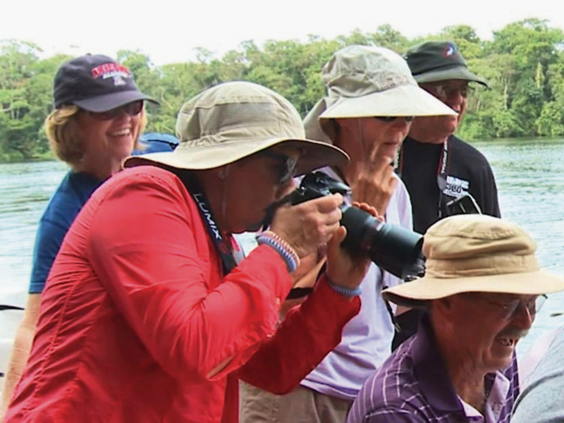 Travelers taking photos on an Overseas Adventure Travel trip
